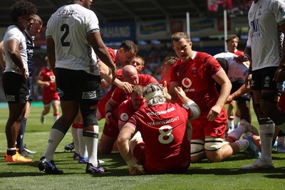040726 - Fiji v Wales - Nations Championship - Jac Morgan of Wales is helped over by team mates to score a try 