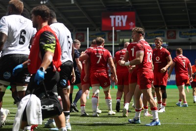 040726 - Fiji v Wales - Nations Championship - Jac Morgan of Wales is helped over by team mates to score a try 