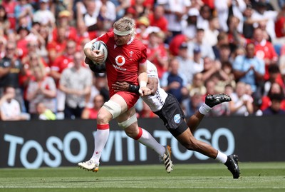 040726 - Fiji v Wales - Nations Championship - Aaron Wainwright of Wales is tackled by Jiuta Wainiqolo of Fiji 