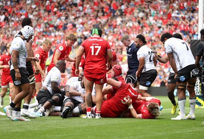 040726 - Fiji v Wales - Nations Championship - Aaron Wainwright of Wales gets over the line to score a try