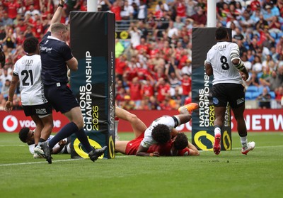 040726 - Fiji v Wales - Nations Championship - Eddie James of Wales celebrates scoring a try with team mates