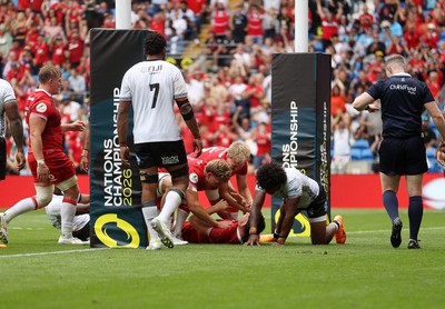 040726 - Fiji v Wales - Nations Championship - Eddie James of Wales celebrates scoring a try with team mates
