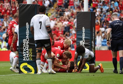 040726 - Fiji v Wales - Nations Championship - Eddie James of Wales celebrates scoring a try with team mates