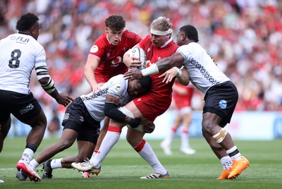 040726 - Fiji v Wales - Nations Championship - Aaron Wainwright of Wales is tackled by Jiuta Wainiqolo of Fiji 