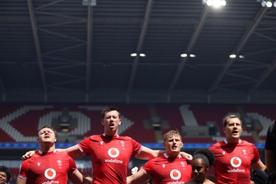040726 - Fiji v Wales - Nations Championship - Dewi Lake, Adam Beard Jac Morgan and Ben Carter of Wales sing the anthem