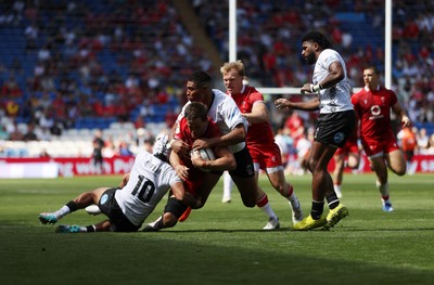 040726 - Fiji v Wales - Nations Championship - Alex Mann of Wales is tackled by Isaiah Armstrong-Ravula of Fiji 
