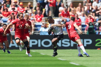 040726 - Fiji v Wales, Nations Championship - Jiuta Wainiqolo of Fiji takes on Tomos Williams of Wales