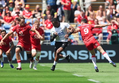 040726 - Fiji v Wales, Nations Championship - Jiuta Wainiqolo of Fiji takes on Tomos Williams of Wales