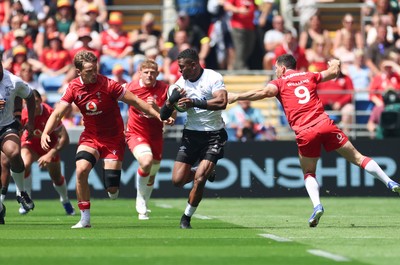 040726 - Fiji v Wales, Nations Championship - Jiuta Wainiqolo of Fiji takes on Tomos Williams of Wales