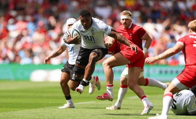 040726 - Fiji v Wales, Nations Championship - Elia Canakaivata of Fiji takes on Blair Murray of Wales