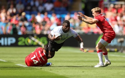 040726 - Fiji v Wales, Nations Championship - Josua Tuisova of Fiji is tackled by Louis Rees-Zammit of Wales