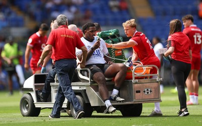 040726 - Fiji v Wales, Nations Championship - Tim Hoyt of Fiji receives treatment before leaving the pitch with an injury