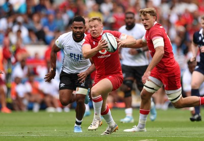 040726 - Fiji v Wales, Nations Championship - Sam Costelow of Wales breaks away