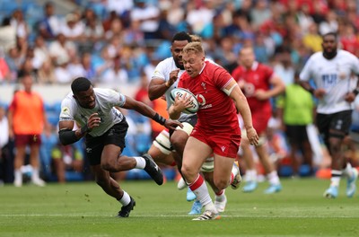 040726 - Fiji v Wales, Nations Championship - Sam Costelow of Wales breaks away