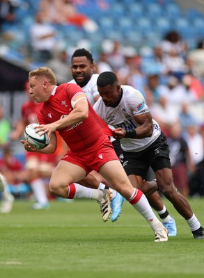 040726 - Fiji v Wales, Nations Championship - Sam Costelow of Wales breaks away