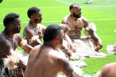 040726 - Fiji v Wales - Nations Championship - Fiji fans huddle before the match on the pitch