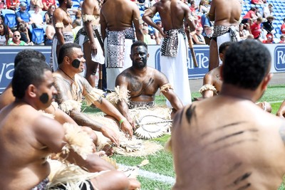 040726 - Fiji v Wales - Nations Championship - Fiji fans huddle before the match on the pitch