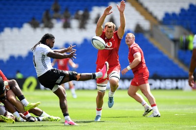 040726 - Fiji v Wales - Nations Championship - Ben Carter of Wales blocks Frank Lomani of Fijis kick