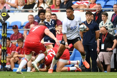 040726 - Fiji v Wales - Nations Championship - Salesi Rayasi of Fiji is challenged by Ellis Mee of Wales