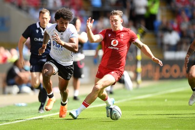 040726 - Fiji v Wales - Nations Championship - Josh Adams of Wales is challenged by Selestino Ravutaumada of Fiji