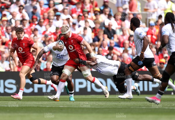 040726 - Fiji v Wales - Nations Championship - Aaron Wainwright of Wales is tackled by Temo Mayanavanua of Fiji 