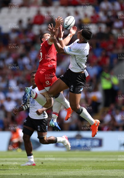 040726 - Fiji v Wales - Nations Championship - Joe Hawkins of Wales goes up for the ball with Salesi Rayasi of Fiji 