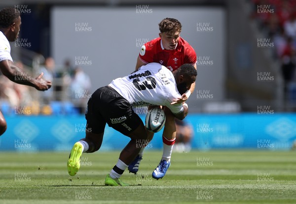 040726 - Fiji v Wales - Nations Championship - Dan Edwards of Wales is tackled by Semi Radradra of Fiji 