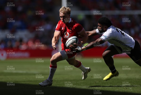 040726 - Fiji v Wales - Nations Championship - Blair Murray of Wales is challenged by Kalaveti Ravouvou of Fiji 