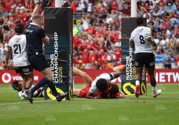 040726 - Fiji v Wales - Nations Championship - Eddie James of Wales celebrates scoring a try with team mates