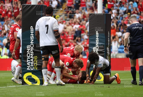 040726 - Fiji v Wales - Nations Championship - Eddie James of Wales celebrates scoring a try with team mates