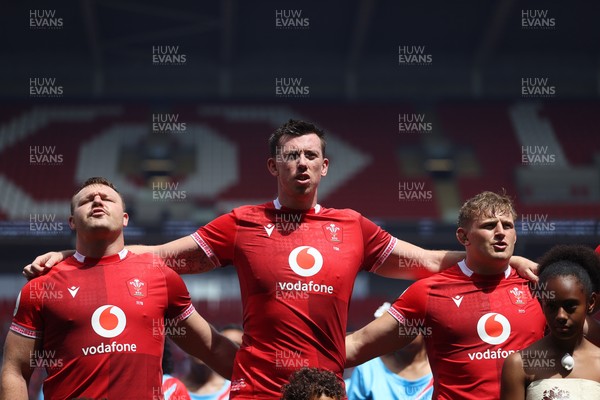 040726 - Fiji v Wales - Nations Championship - Dewi Lake, Adam Beard and Jac Morgan of Wales sing the anthem