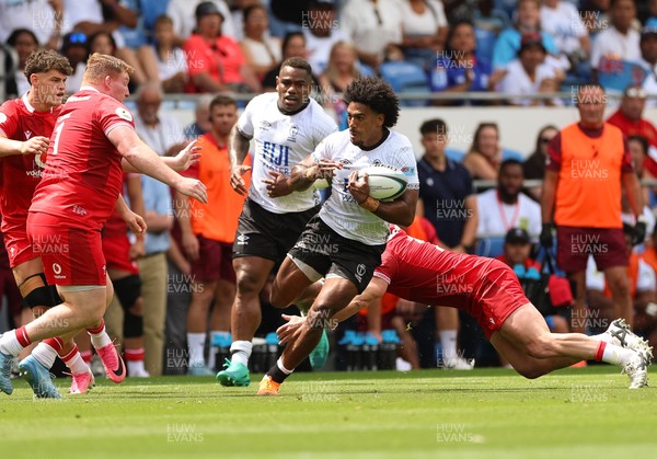 040726 - Fiji v Wales, Nations Championship - Selestino Ravutaumada of Fiji takes on Rhys Carre of Wales