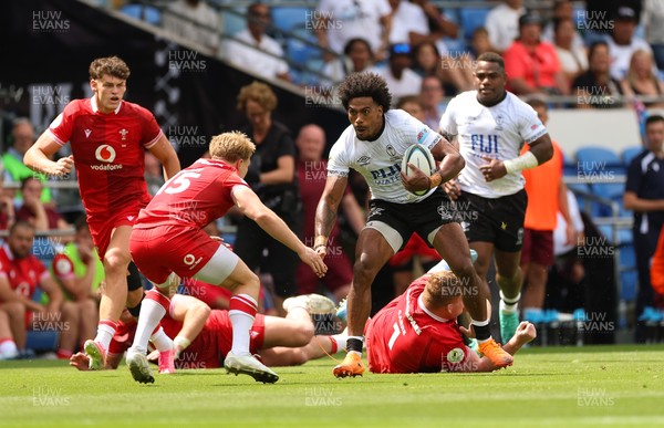 040726 - Fiji v Wales, Nations Championship - Selestino Ravutaumada of Fiji takes on Blair Murray of Wales
