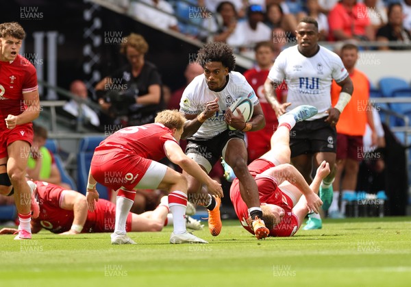 040726 - Fiji v Wales, Nations Championship - Selestino Ravutaumada of Fiji takes on Blair Murray of Wales