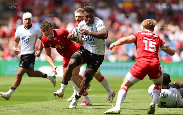 040726 - Fiji v Wales, Nations Championship - Elia Canakaivata of Fiji takes on Blair Murray of Wales