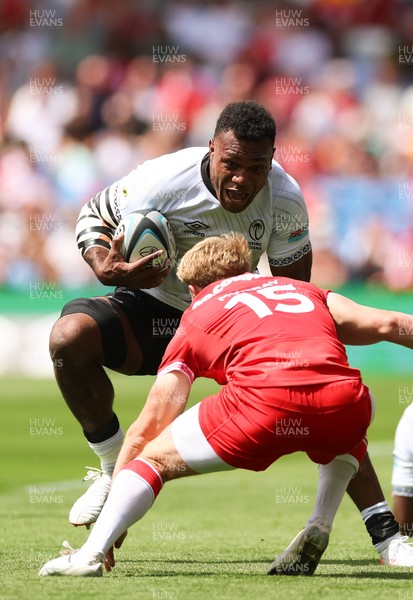 040726 - Fiji v Wales, Nations Championship - Elia Canakaivata of Fiji takes on Blair Murray of Wales