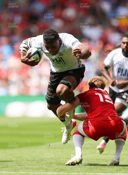 040726 - Fiji v Wales, Nations Championship - Elia Canakaivata of Fiji takes on Blair Murray of Wales
