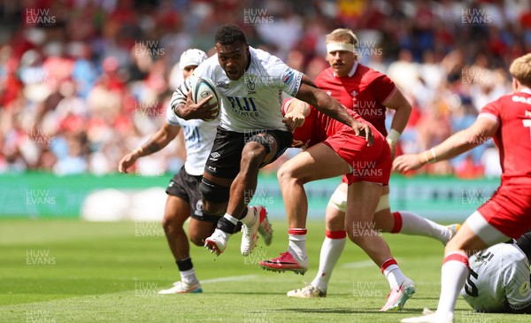 040726 - Fiji v Wales, Nations Championship - Elia Canakaivata of Fiji takes on Blair Murray of Wales