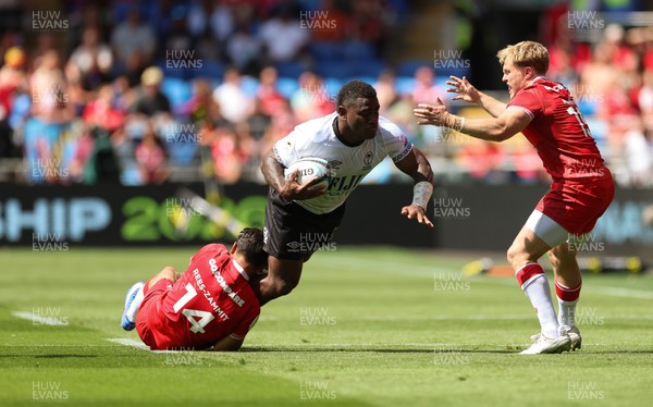040726 - Fiji v Wales, Nations Championship - Josua Tuisova of Fiji is tackled by Louis Rees-Zammit of Wales