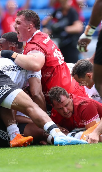 040726 - Fiji v Wales, Nations Championship - Ryan Elias of Wales powers over to score try