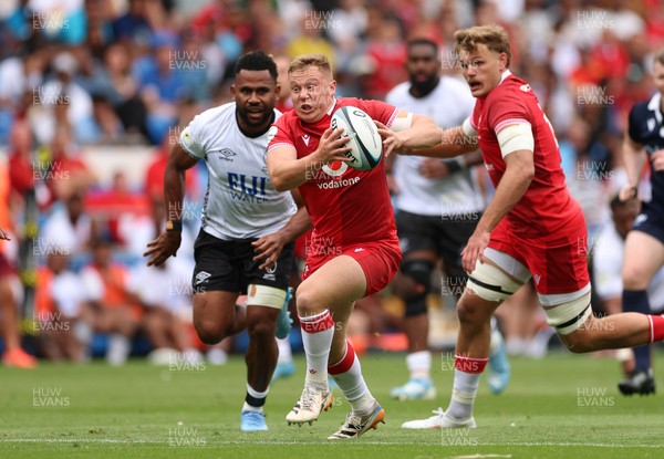 040726 - Fiji v Wales, Nations Championship - Sam Costelow of Wales breaks away