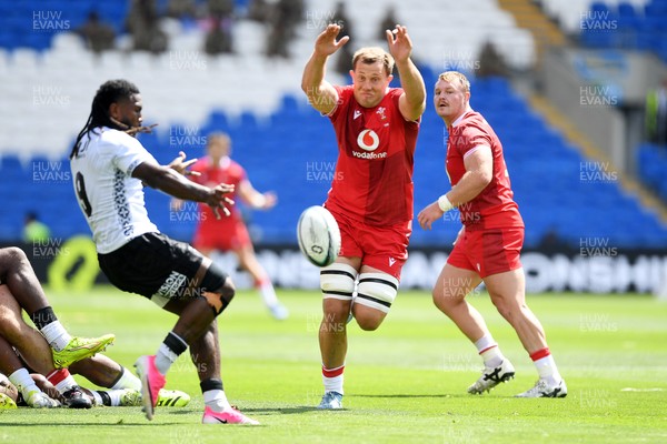 040726 - Fiji v Wales - Nations Championship - Ben Carter of Wales blocks Frank Lomani of Fijis kick