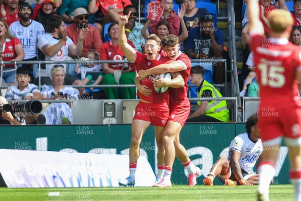 040726 - Fiji v Wales - Nations Championship - Josh Adams of Wales celebrates scoring a try with team mates