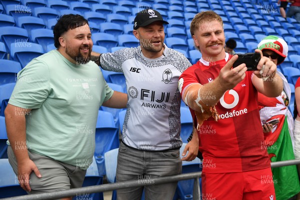 040726 - Fiji v Wales - Nations Championship - Aaron Wainwright of Wales with fans at full time