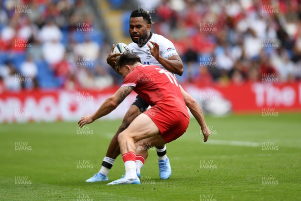 040726 - Fiji v Wales - Nations Championship - Vilimoni Botitu of Fiji is challenged by Josh Adams of Wales