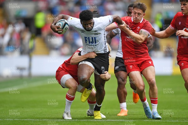 040726 - Fiji v Wales - Nations Championship - Kalaveti Ravouvou of Fiji is challenged by Josh Adams of Wales