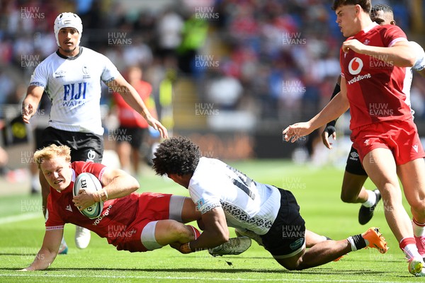 040726 - Fiji v Wales - Nations Championship - Blair Murray of Wales is challenged by Selestino Ravutaumada of Fiji