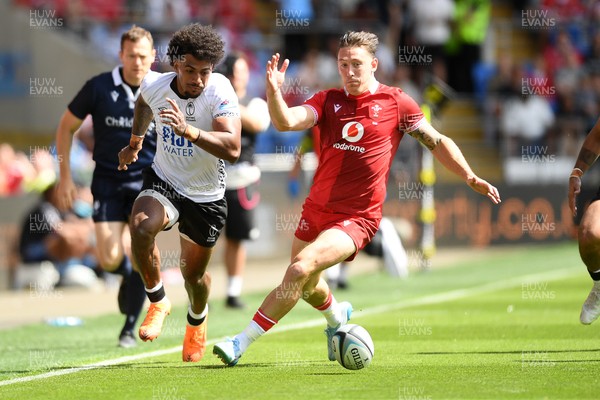 040726 - Fiji v Wales - Nations Championship - Josh Adams of Wales is challenged by Selestino Ravutaumada of Fiji