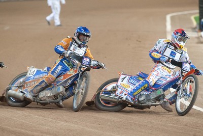 10.07.10 - FIM British Speedway Grand Prix Jason Crump ahead of Chris Harris during the heats 