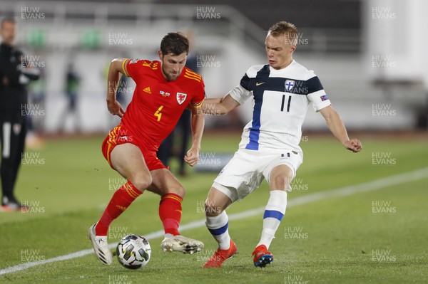 030920 - Finland v Wales - UEFA Nations League - Ben Davies of Wales is challenged by Ilmari Niskanen of Finland